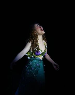Student playing Ariel in HOOLIGAN's production of A Little Mermaid